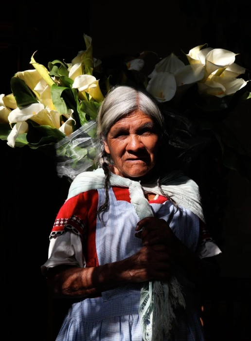 WOMAN – SELLING FLOWERS